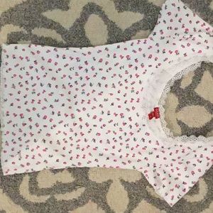 From Guess purchased wrong size, white with roses.